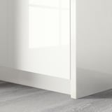 Modern wardrobe with high-gloss, seamless white cover panel. Finished with smooth edges.