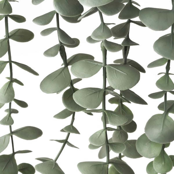 Artificial eucalyptus plant with vibrant green leaves, arranged naturally for lifelike appearance.