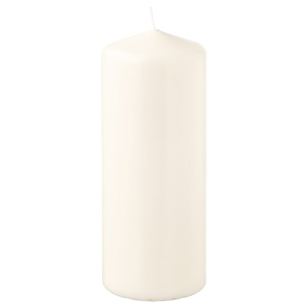 FENOMEN white pillar candle, elegant and simple, made from plant-based and paraffin wax, standing upright.