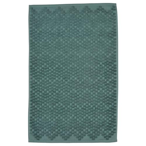 A FJÄLLKATTFOT bath mat in turquoise. Rectangular, textured with a cotton weave.