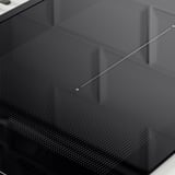 Black induction hob with a perforated black surface, sleek design, and modern aesthetic.