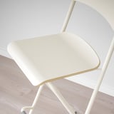 Modern white bar stool with a smooth, sturdy seat and curved back, perfect for any kitchen or dining space.