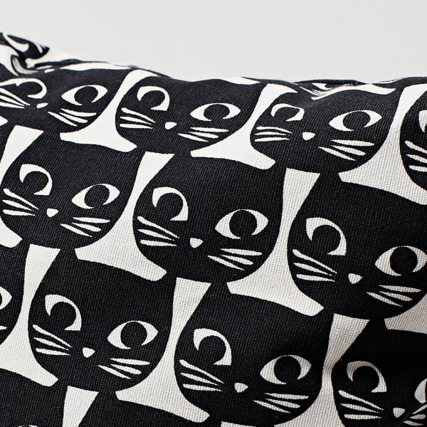 Black and white cat-themed fabric pouch. Repeated cat heads, stylized, on textured cotton material.