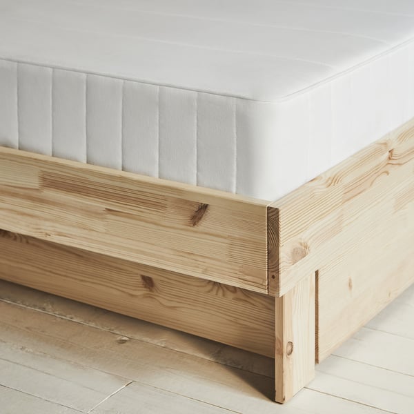 GLAMBERGET light wood bed with white mattress, minimalist design.