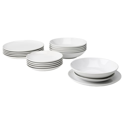 Set of white stoneware plates and bowls, simple and stylish design for everyday use.