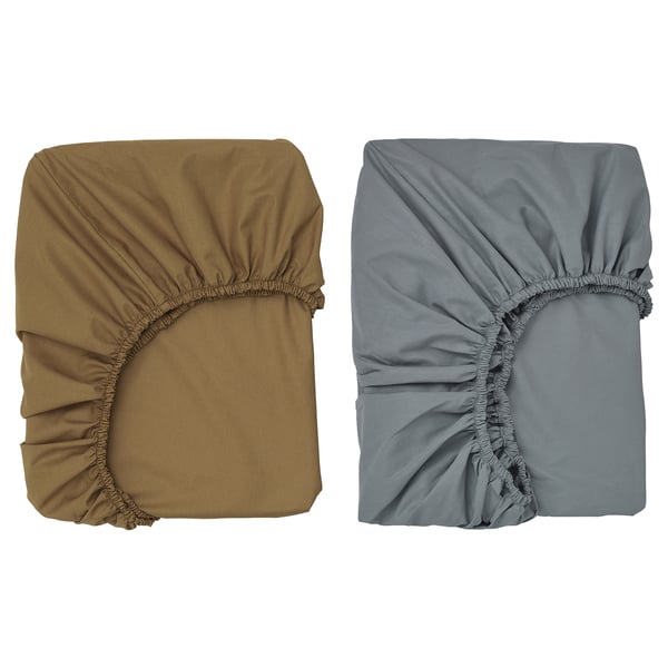 Two fitted sheets displayed side by side, one beige, one gray, made of gots-certified organic cotton, with gathered elastic edges.