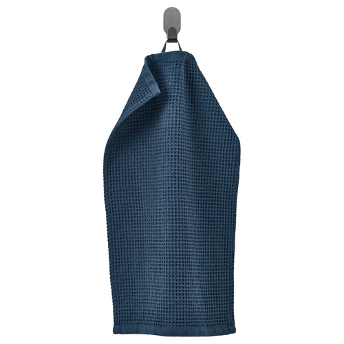 A blue GULLDYNA towel, made from recycled cotton, hanging on a hook. It is rectangular with a textured weave, ideal for bath use.