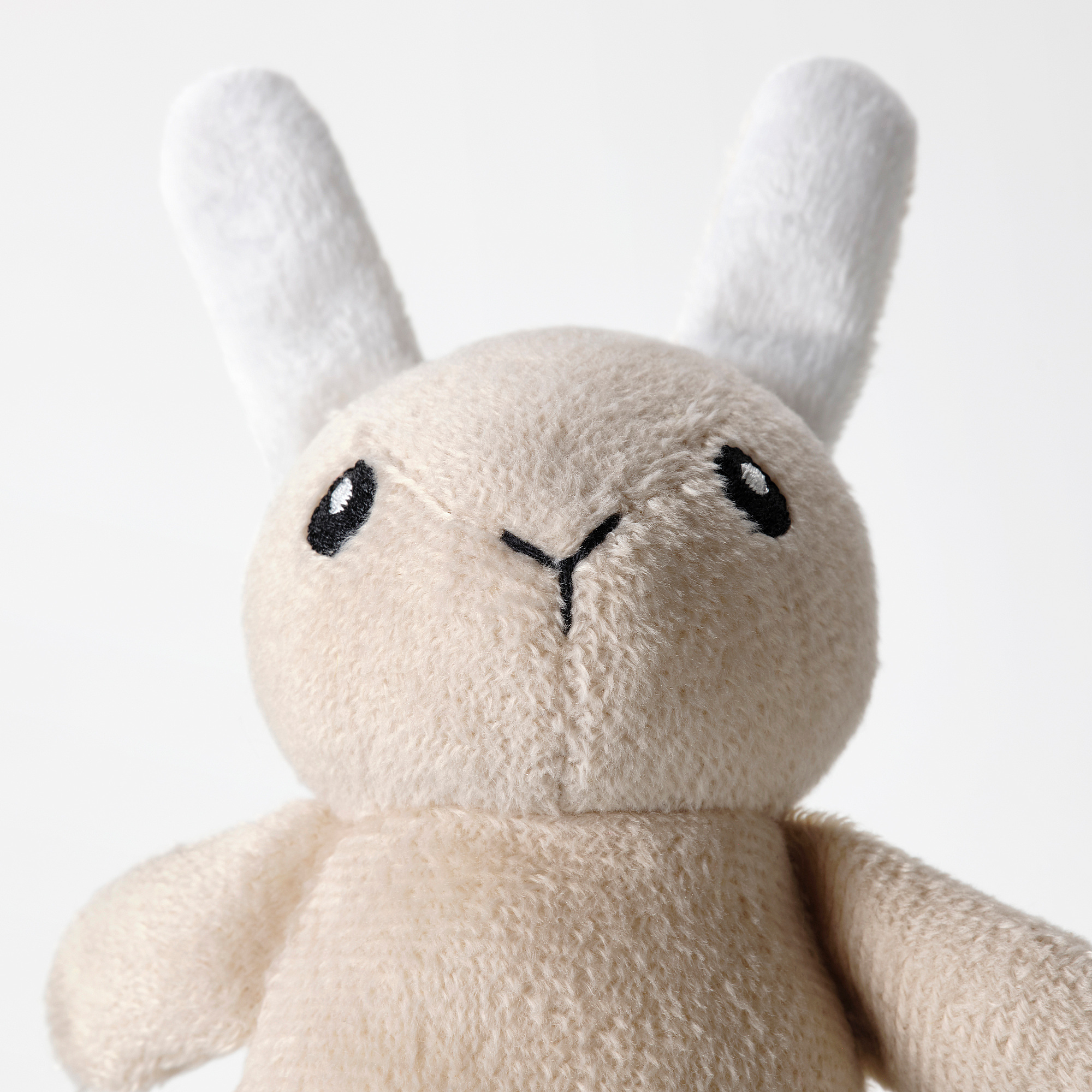 Soft plush toy with simple, friendly ; perfect for cuddling.