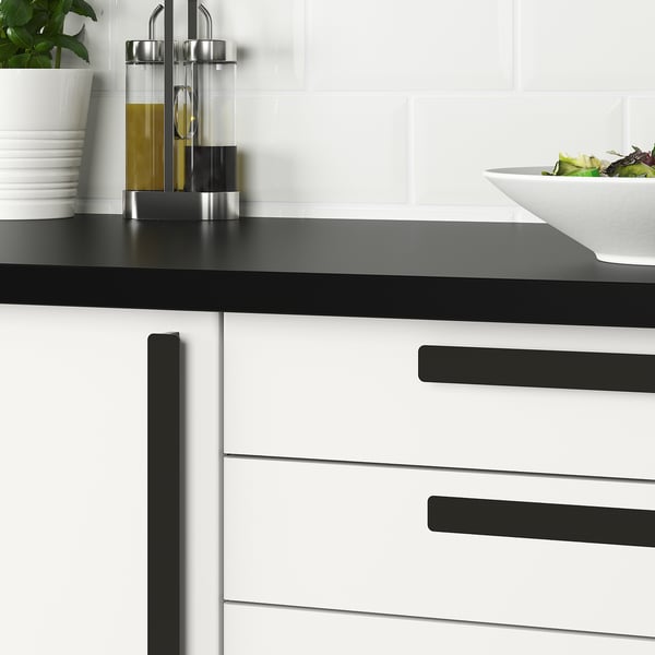 Modern kitchen handles in black and white, with sleek design for easy grip. Suitable for doors 16-21 mm thick.