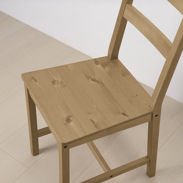Wooden chair, light finish, sturdy.