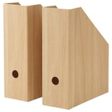 Two beige, conical magazine holders made of recycled paper.
