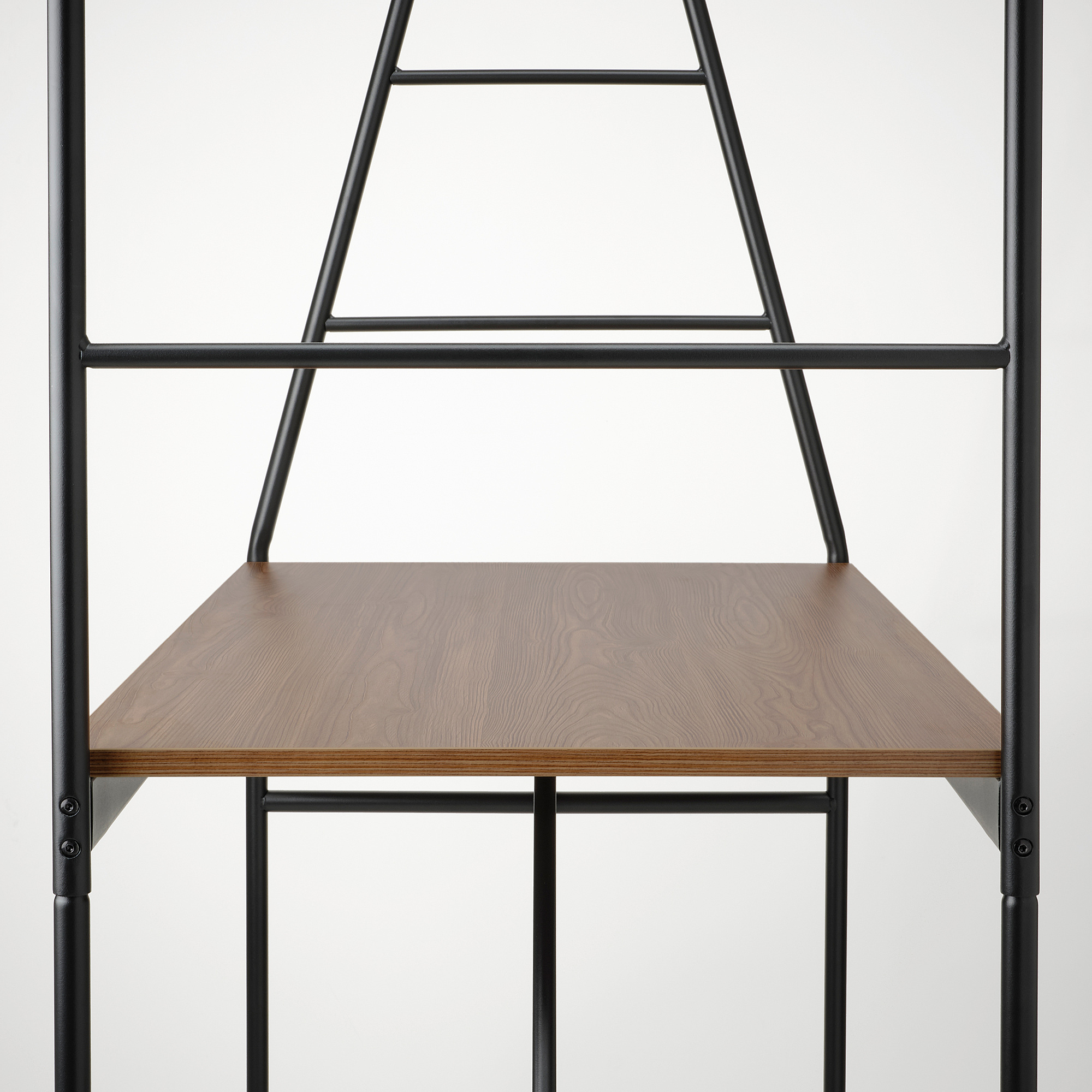Modern table with black metal frame and wooden top, featuring a unique ladder-style storage solution.