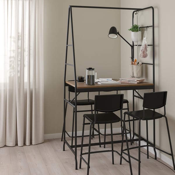 Modern black HÅVERUD counter table with storage ladder and bar stools near windows.