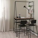Modern black HÅVERUD counter table with storage ladder and bar stools near windows.