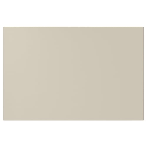 A beige HAVSTORP rectangular kitchen cabinet door made from acrylic-painted fiberboard, with smooth edges.