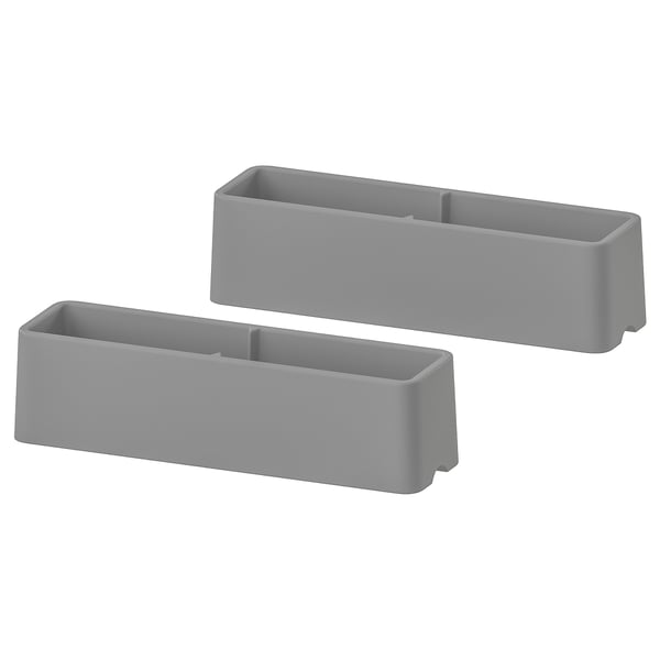Two grey, rectangular, plastic HEJNE post caps. They are designed to protect post ends.