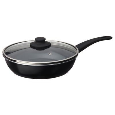 Black, round skillet with glass lid and black handle.
