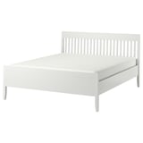 White IDANÄS bed with sleek, slatted headboard and footboard, clean lines, sturdy wooden frame, and elevated legs.