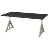 An IKEA IDÅSEN desk with a black top and adjustable silver legs. Its rectangular and has a modern, minimalist design with built-in cable management.
