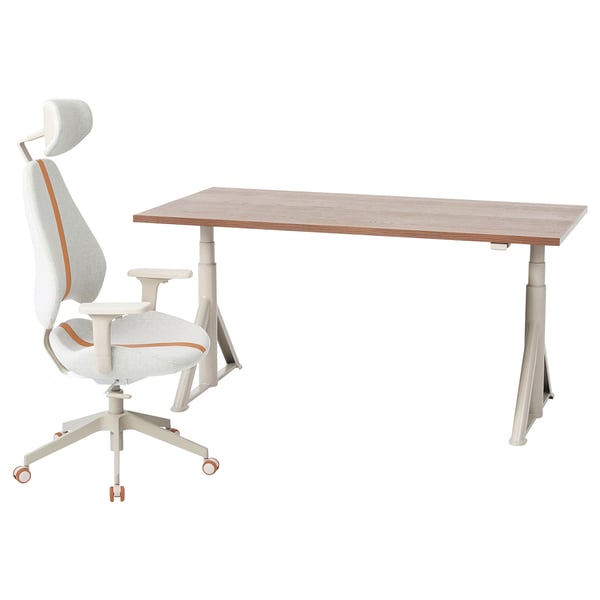IDÅSEN adjustable desk & gaming chair. Light brown desk, orange-accented white chair.