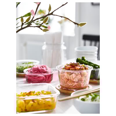 IKEA 365+ glass jar with bamboo lid. Round, clear container with a wooden lid, suitable for storing and serving food.