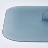 Light blue, smooth plastic vacuum lid with curved edges and indent for grip, displayed on white background.