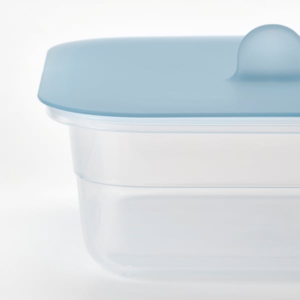 Clear plastic container with light blue lid, designed for food storage and microwave use.