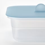 Clear plastic container with light blue lid, designed for food storage and microwave use.