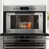 Stainless steel microwave with glass container and IKEA 365+ vacuum lid.
