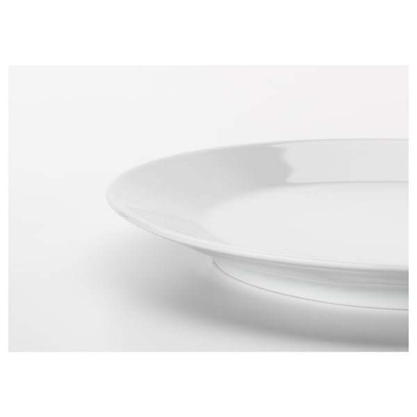 Close-up of sleek, white porcelain plate edge from IKEA 365+, smooth finish reflects light, showcasing durability and elegant simplicity.