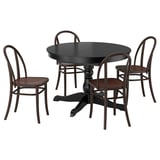 Round wooden dining table with 4 chairs, metal accents, compact design.