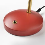 Red desk lamp base with gold kitchen, flexible neck, and cord, showcasing its modern design and durable materials.