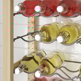 Metal wine rack holding red and white bottles, part of IVAR storage system.