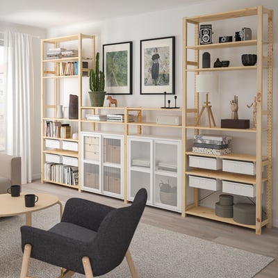 IVAR storage with wood shelves & metal cabinets, neatly organized, minimalist design, sustainably sourced.
