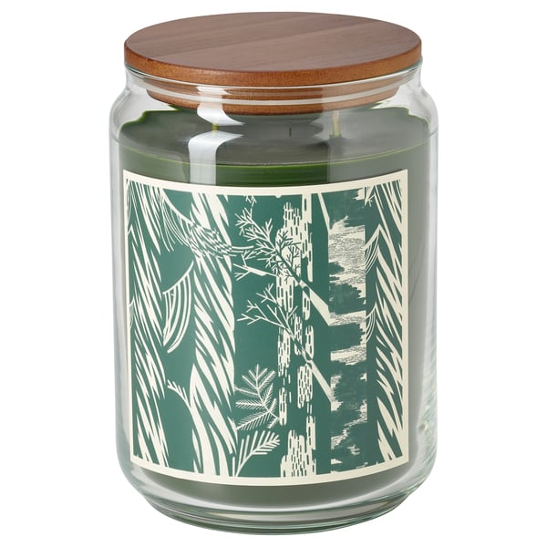 Green glass candle jar with wooden lid, pine forest design, natural scent.