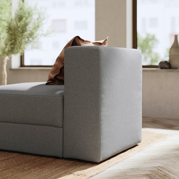 Modern grey modular sofa box in stylish living room, offering comfort and storage.