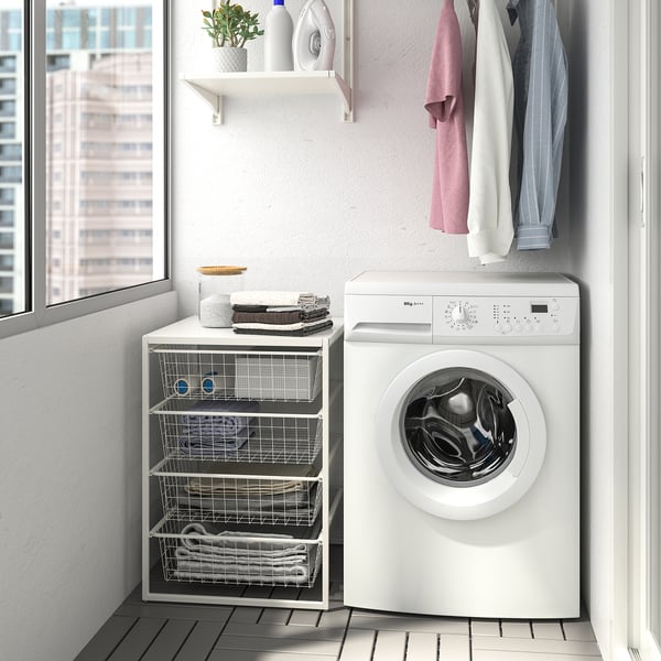 JONAXEL white storage unit beside washing machine, perfect for small spaces.