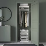 White JONAXEL storage with baskets. Compact, humid-safe.