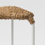 Hand-braided banana fiber seat on sturdy 3-legged stool; natural, durable, and beautifully crafted.