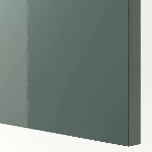 A glossy green-grey kitchen cabinet front, smooth and reflective, showcasing its modern design and durable finish.