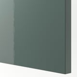 A glossy green-grey kitchen cabinet front, smooth and reflective, showcasing its modern design and durable finish.