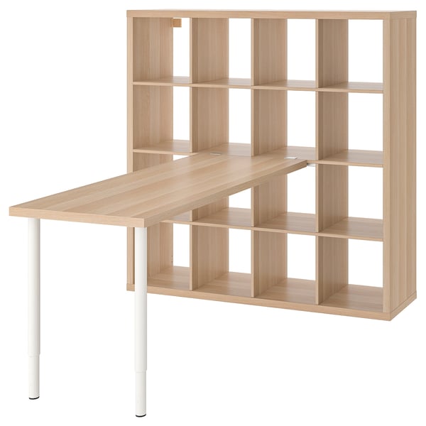 An ikea KALLAX unit with a light oak desk attached. It combines storage and workspace efficiently.