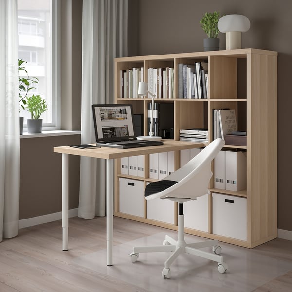 Home office with KALLAX desk, chair, and bookshelf.
