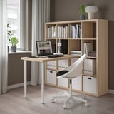 Home office with KALLAX desk, chair, and bookshelf.