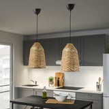 Modern kitchen with two KAPPELAND pendant lamps, providing warm, decorative light. Herringbone rattan shades enhance atmosphere.