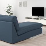 Modern living room with blue KIVIK chaise longue, flat screen tv, and plant. The chaise is large, matching the sofas size.
