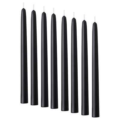 Eight black KLOKHET candles, slim, cylindrical shape, made of stearin.