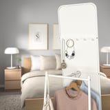 Mirror with hooks and rail, ideal for hanging clothes and jewelry, saves space and time.