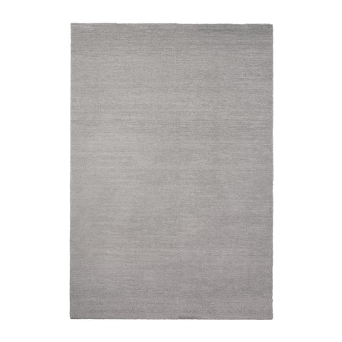 Grey rectangular rug, shiny texture, soft and thick pile.