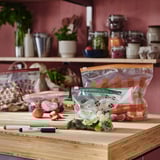 Ikea KÖSSEBÄR bags with fruits/veggies on counter